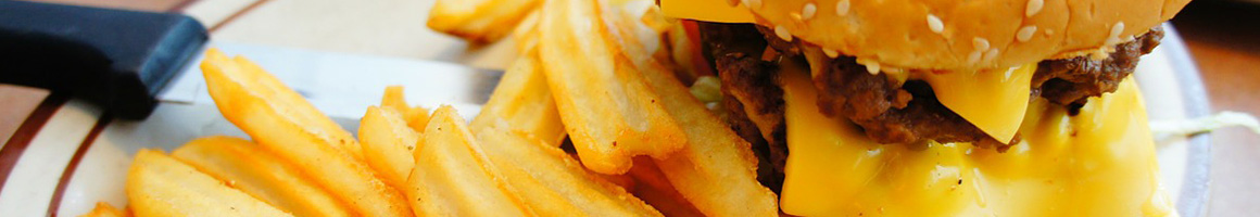 Eating Burger at Burger Fresh & More restaurant in Conroe, TX.